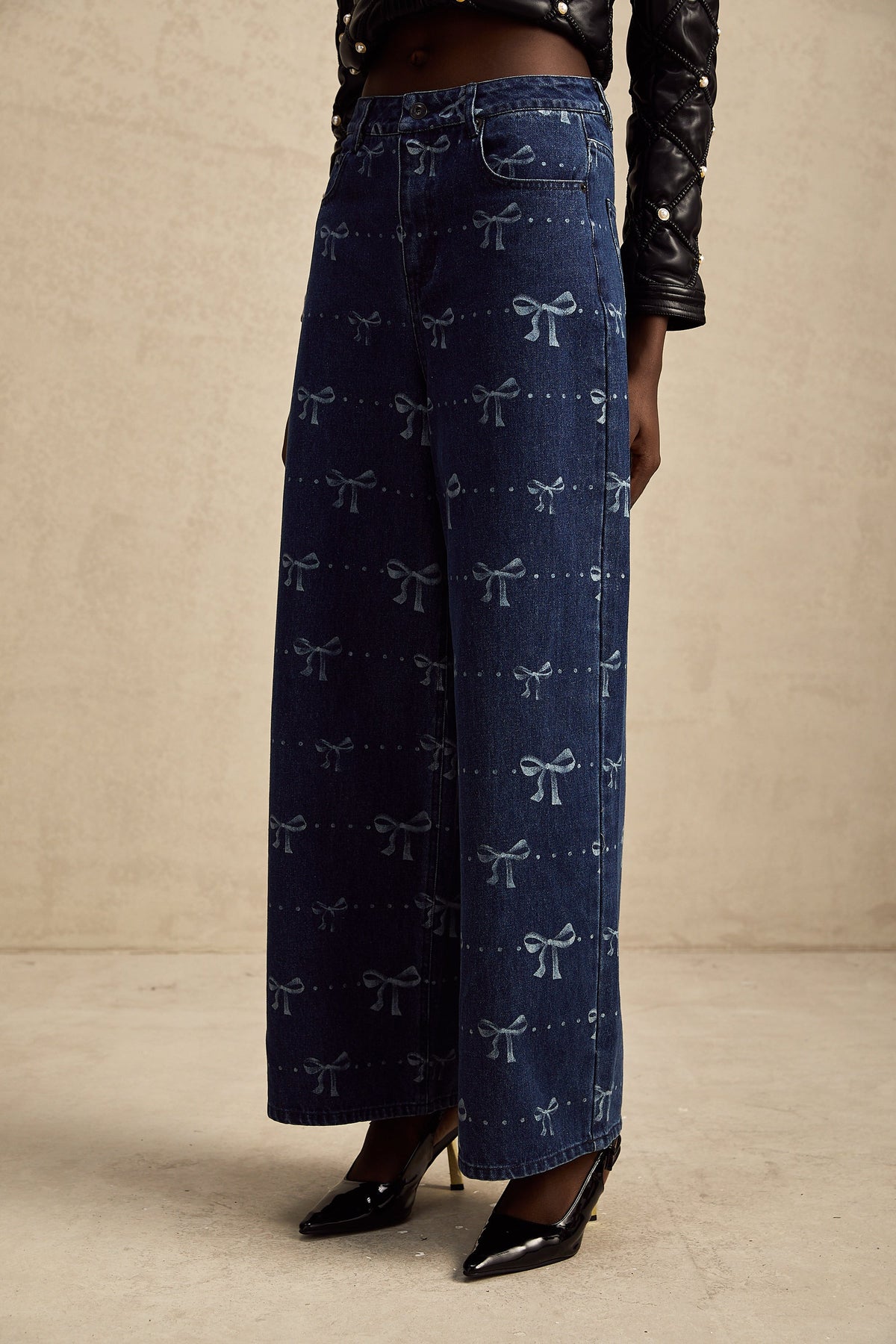 Yvonne bow-motif wide-leg jeans