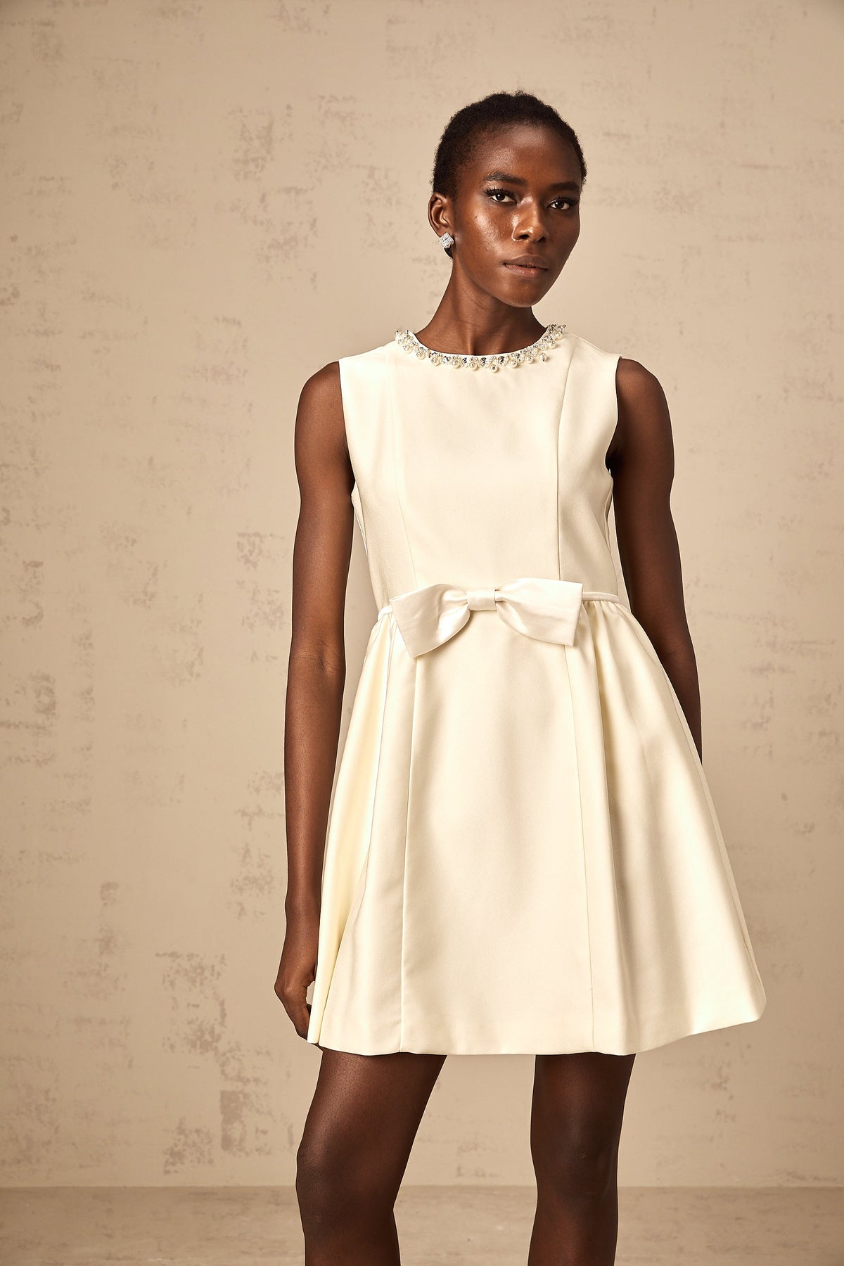 Isabelle white bowknot embellished mini dress