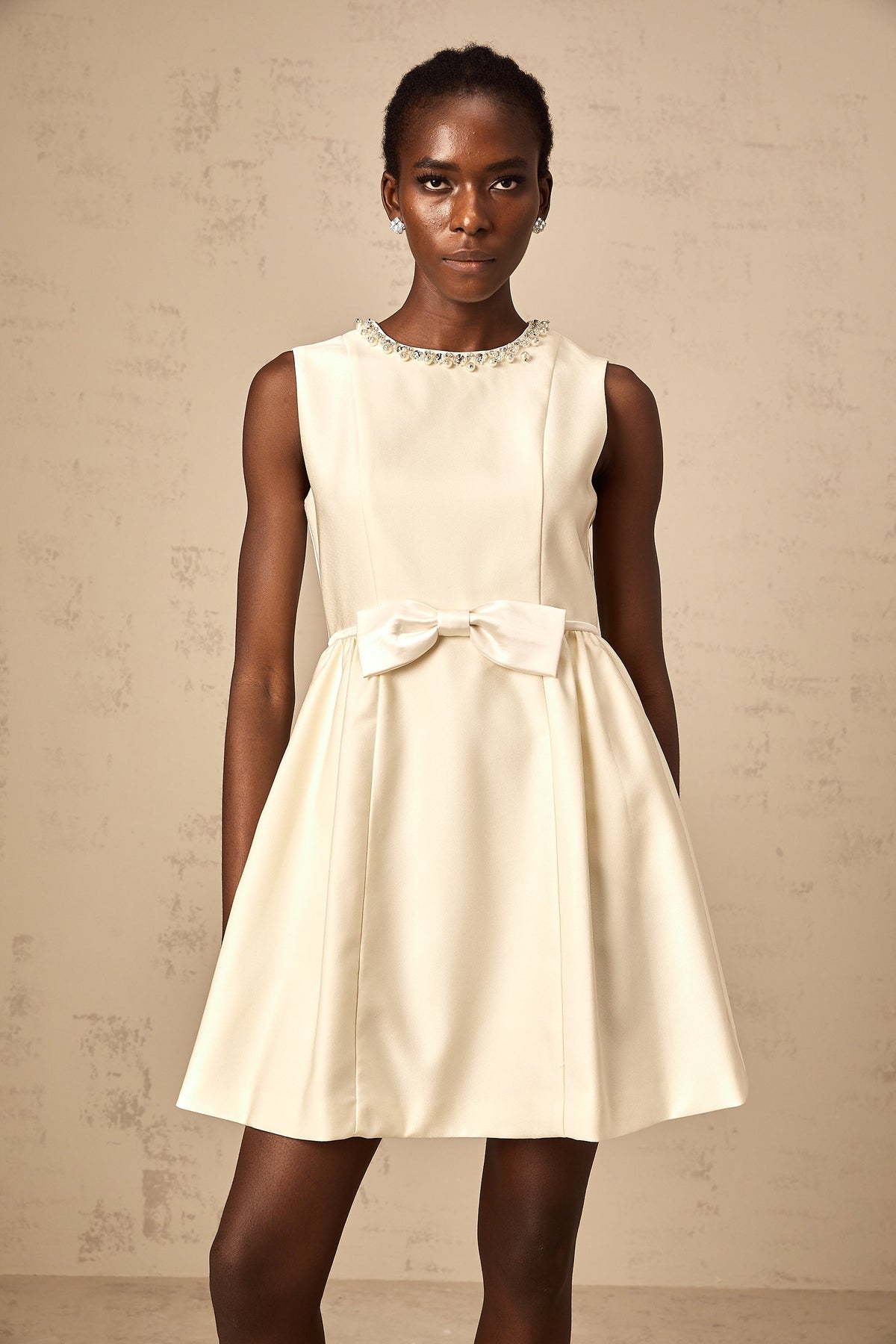 Isabelle white bowknot embellished mini dress
