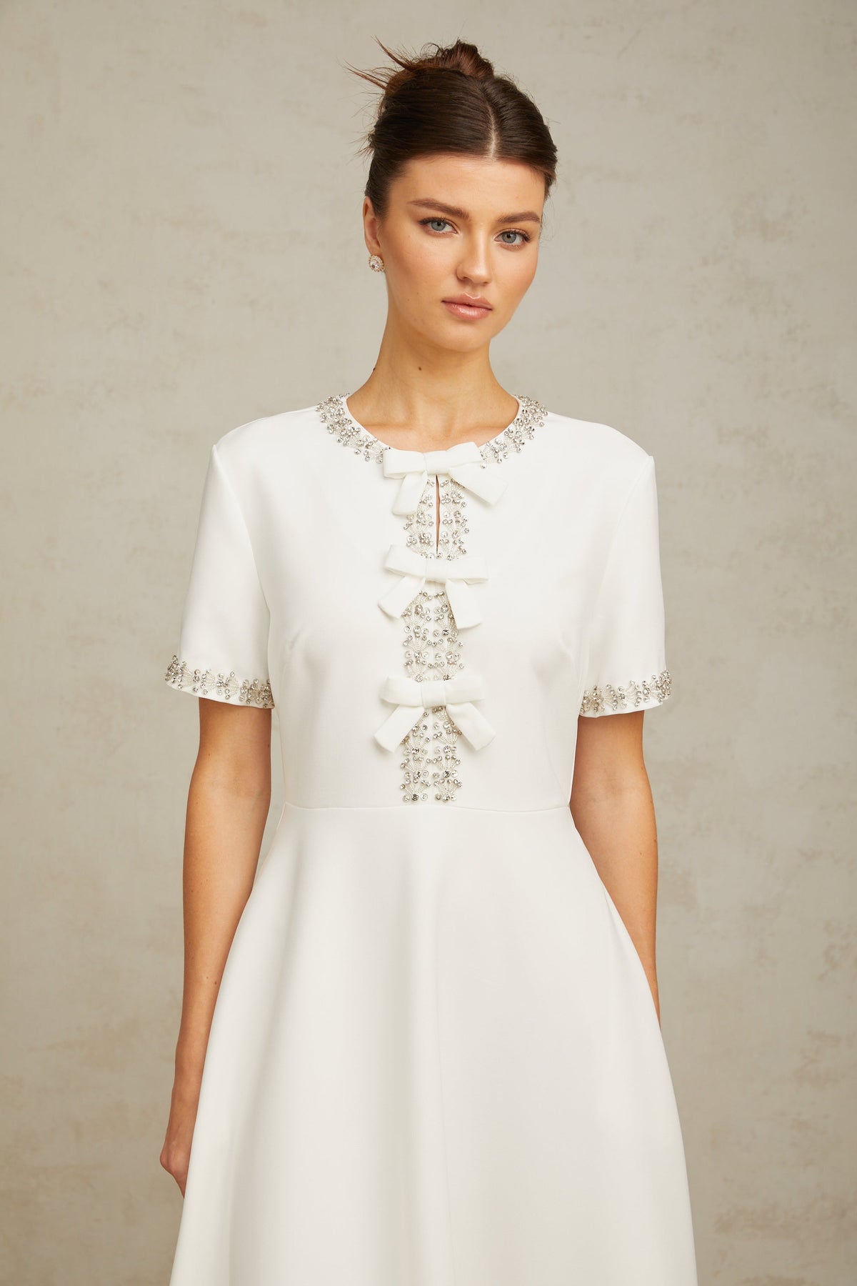 Cassiopeia crystal-accented bow midi dress in White