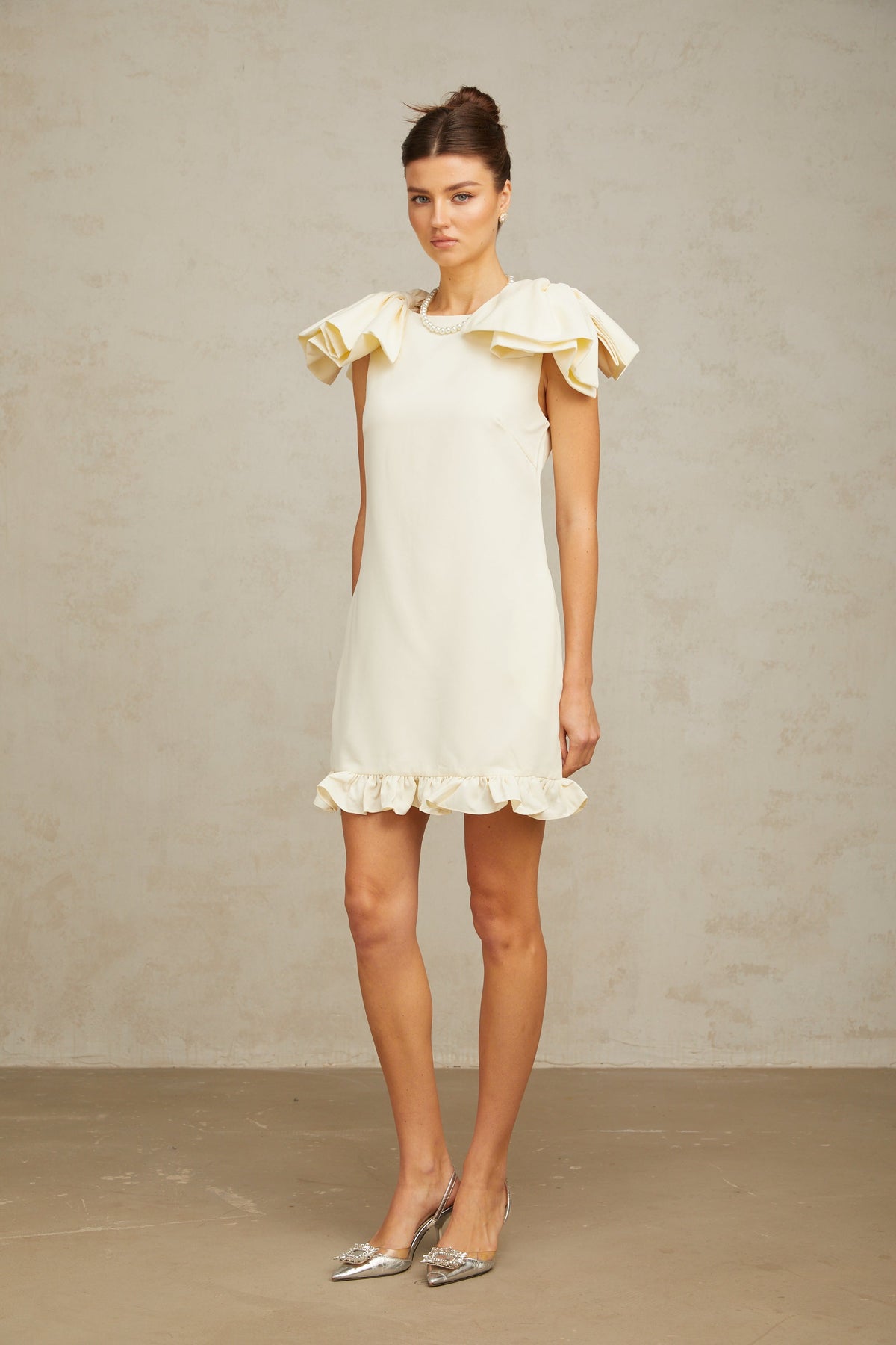 Constance white bow ruffled mini dress