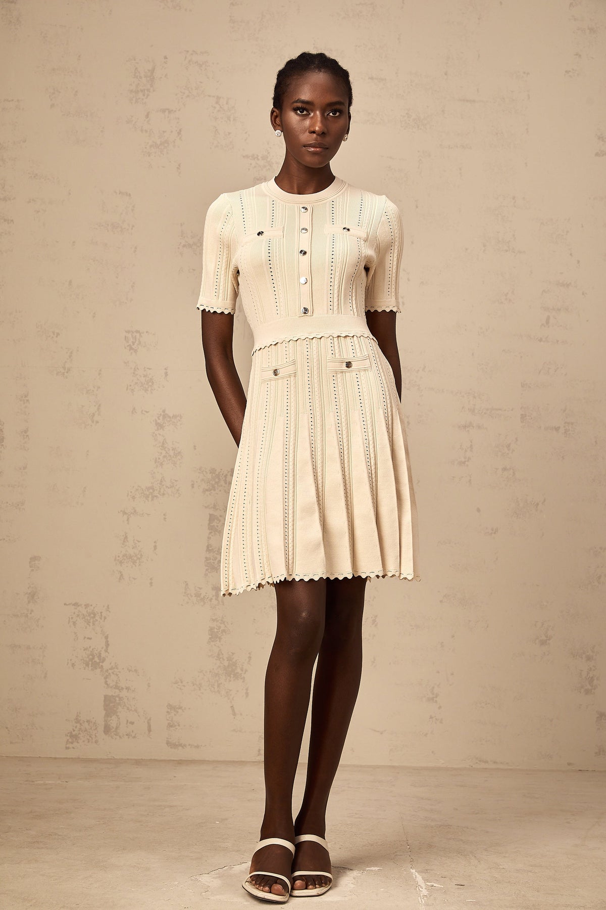 Amélie neutrals pointelle-trim pleated knit mini dress