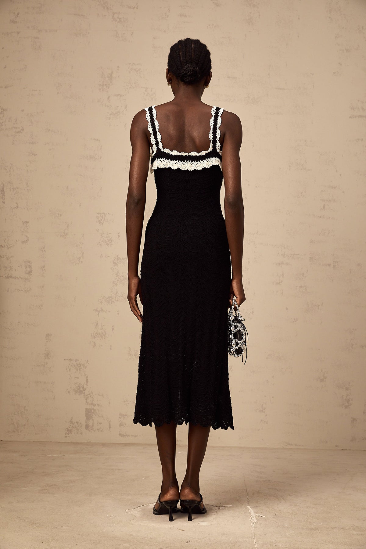 Noémie black sleeveless crochet-knit midi dress
