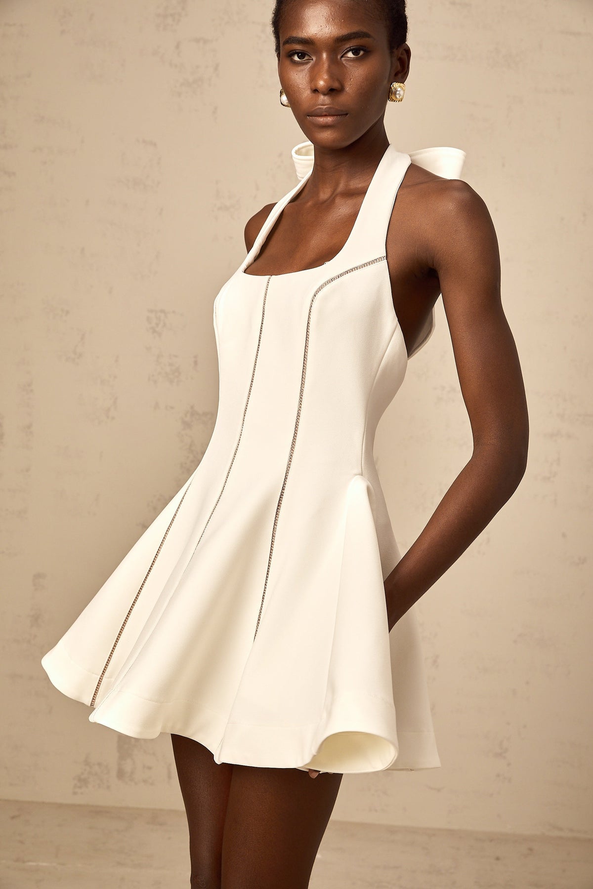 Quirine halterneck bow-detail mini dress in White