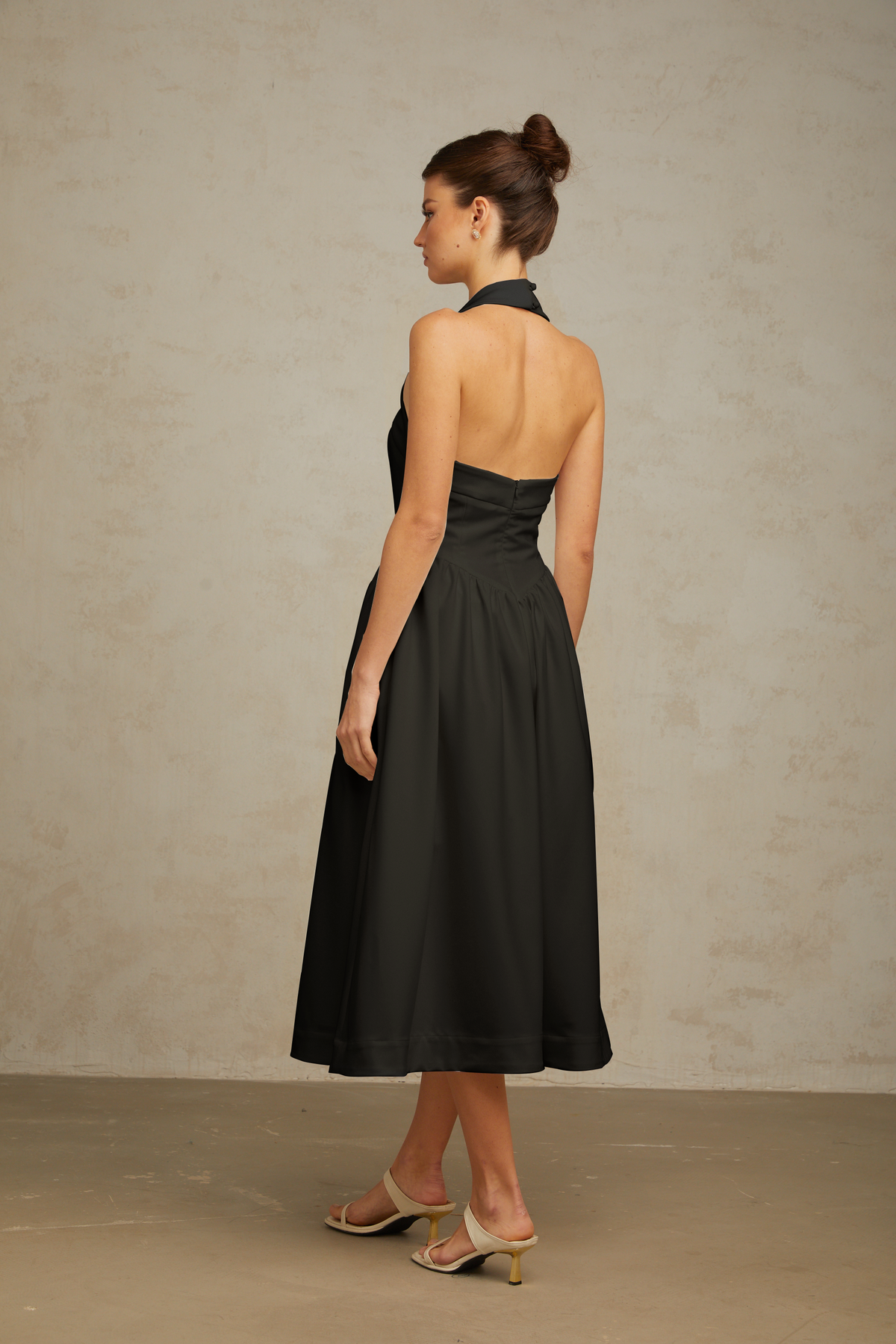 Alizée halterneck pleated midi dress in Black
