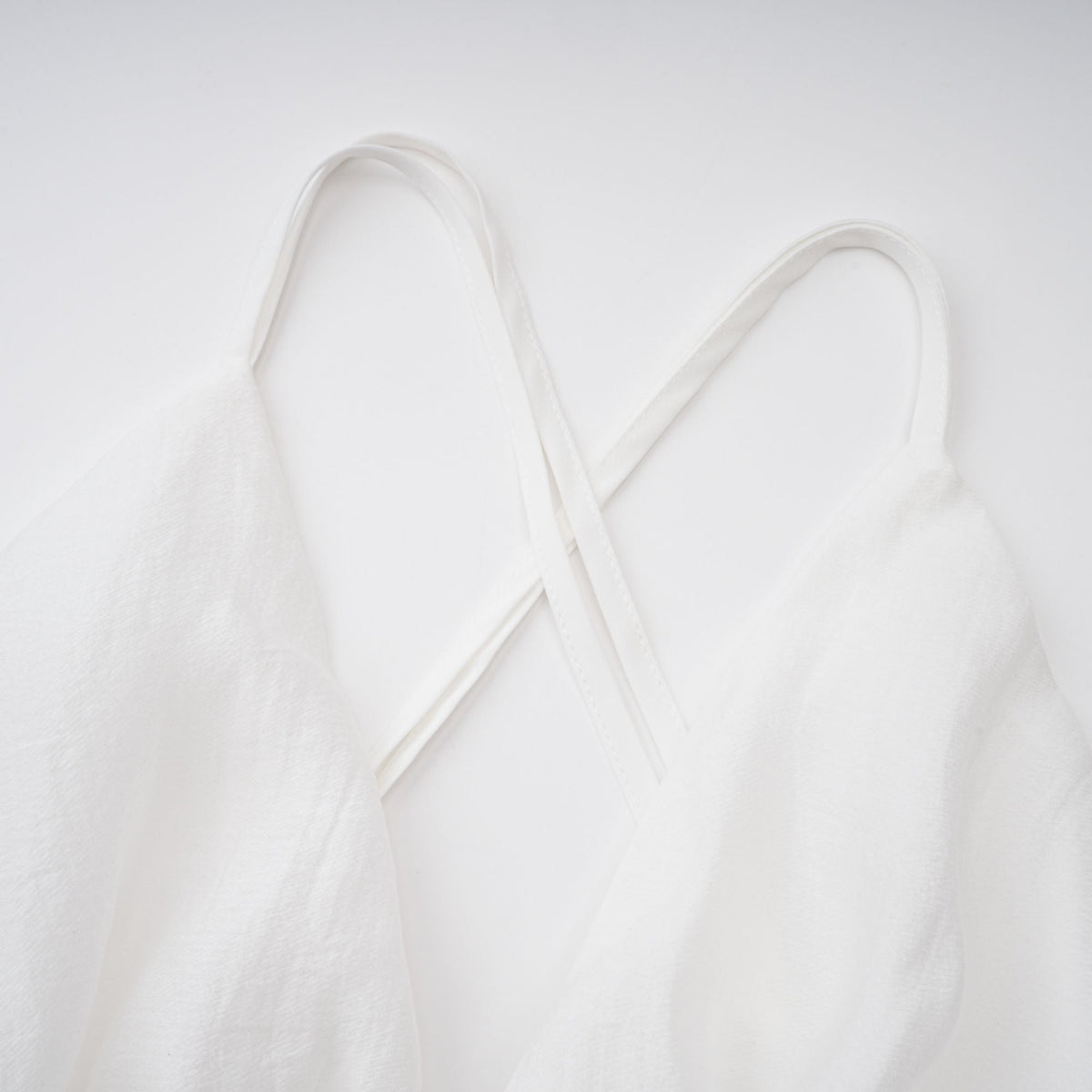 Quincie white shirred flounced mini dress