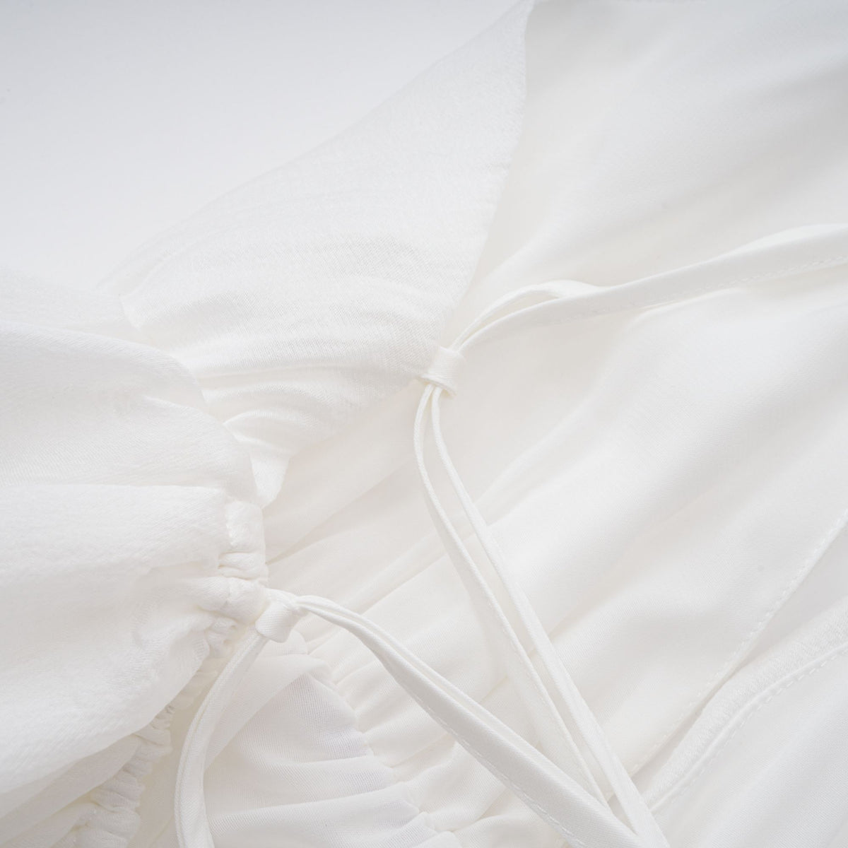 Quincie white shirred flounced mini dress