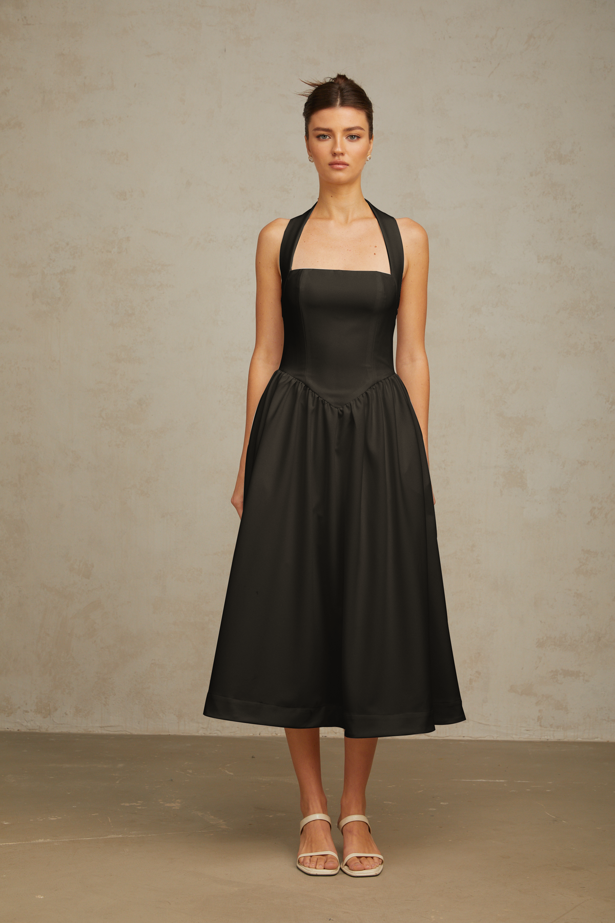 Alizée halterneck pleated midi dress in Black