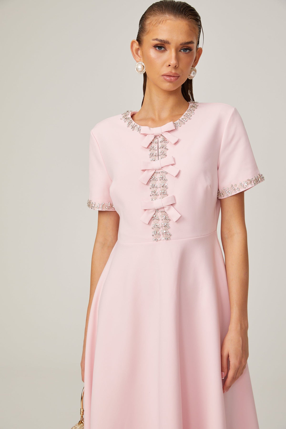 Cassi crystal-accented pink bow midi dress