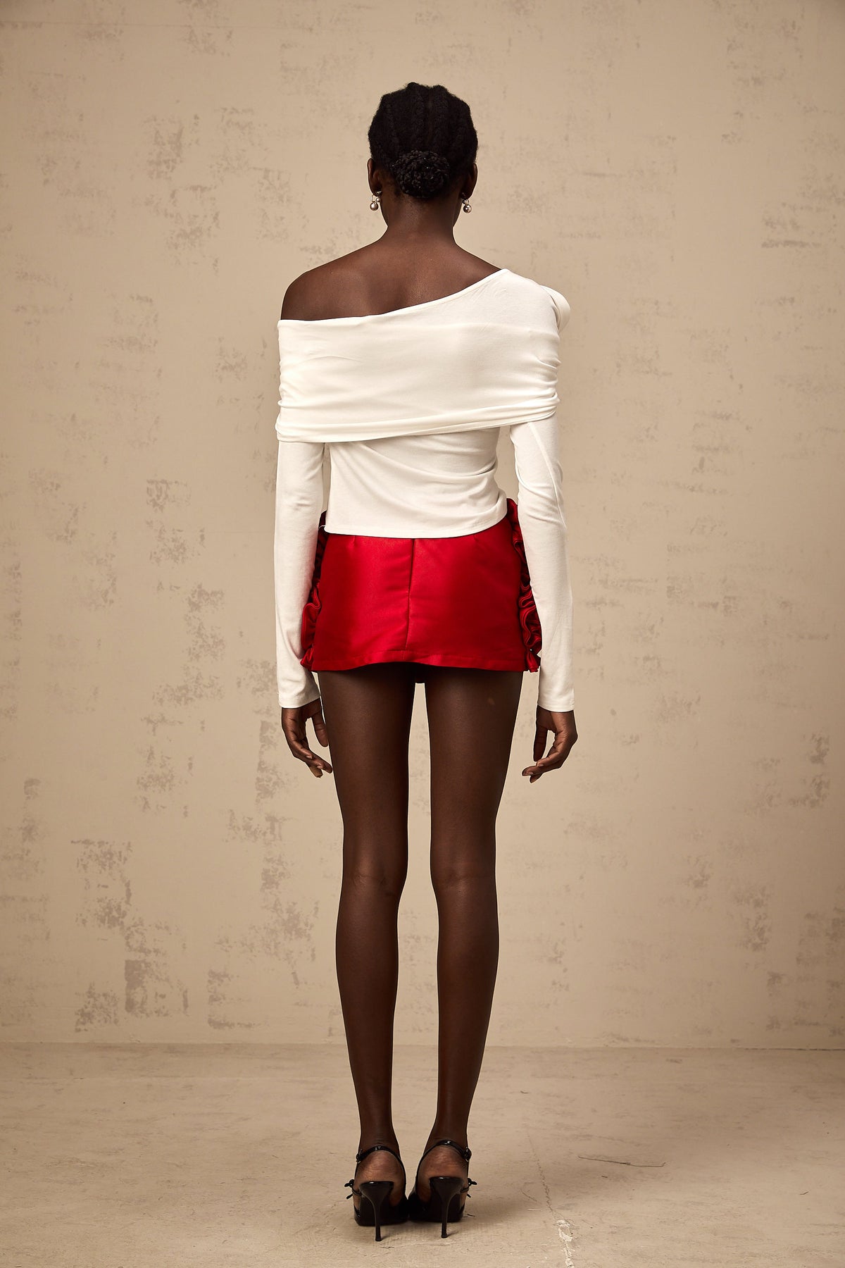 Zoéline white asymmetrical twisted jersey top