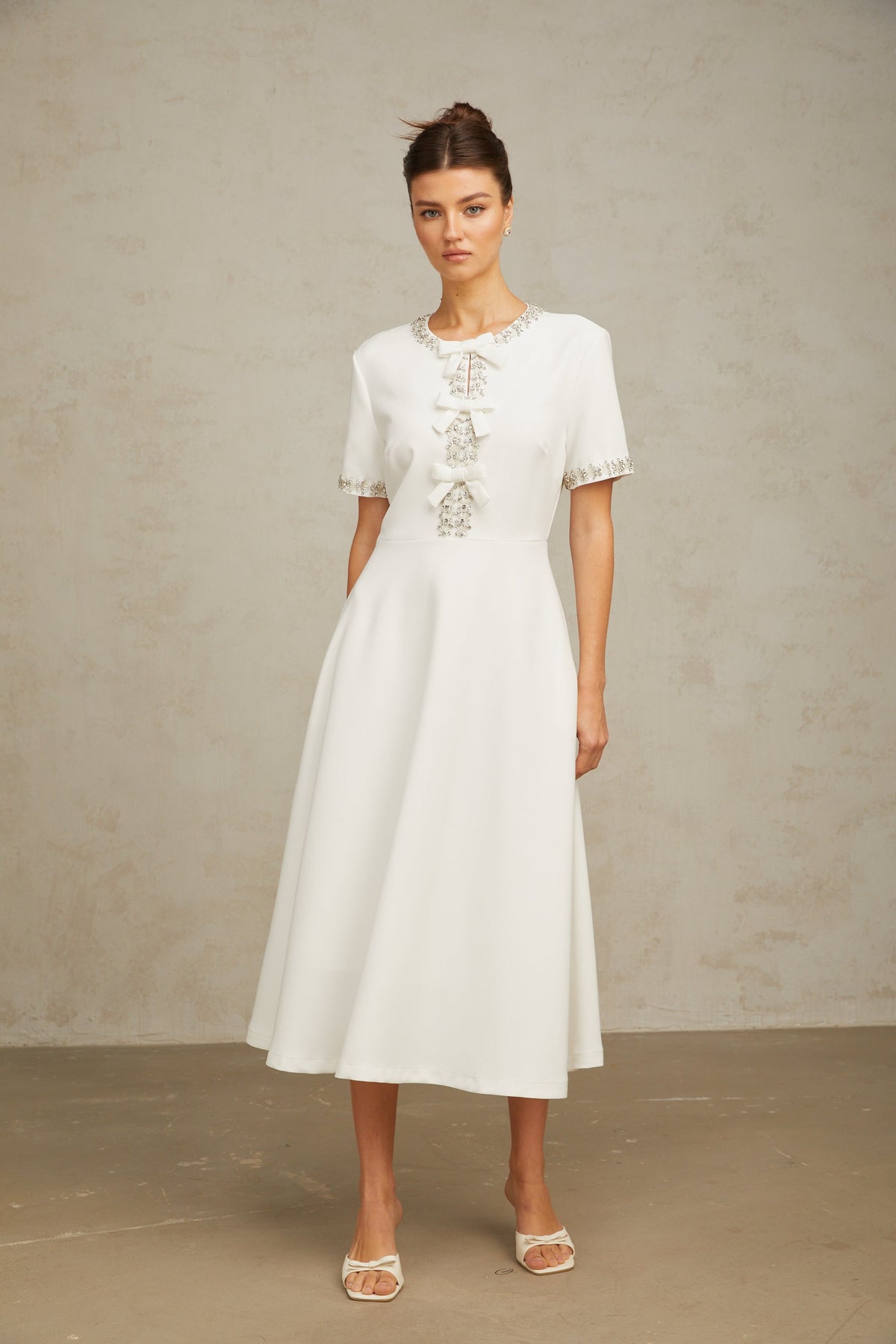 Cassiopeia crystal-accented bow midi dress in White