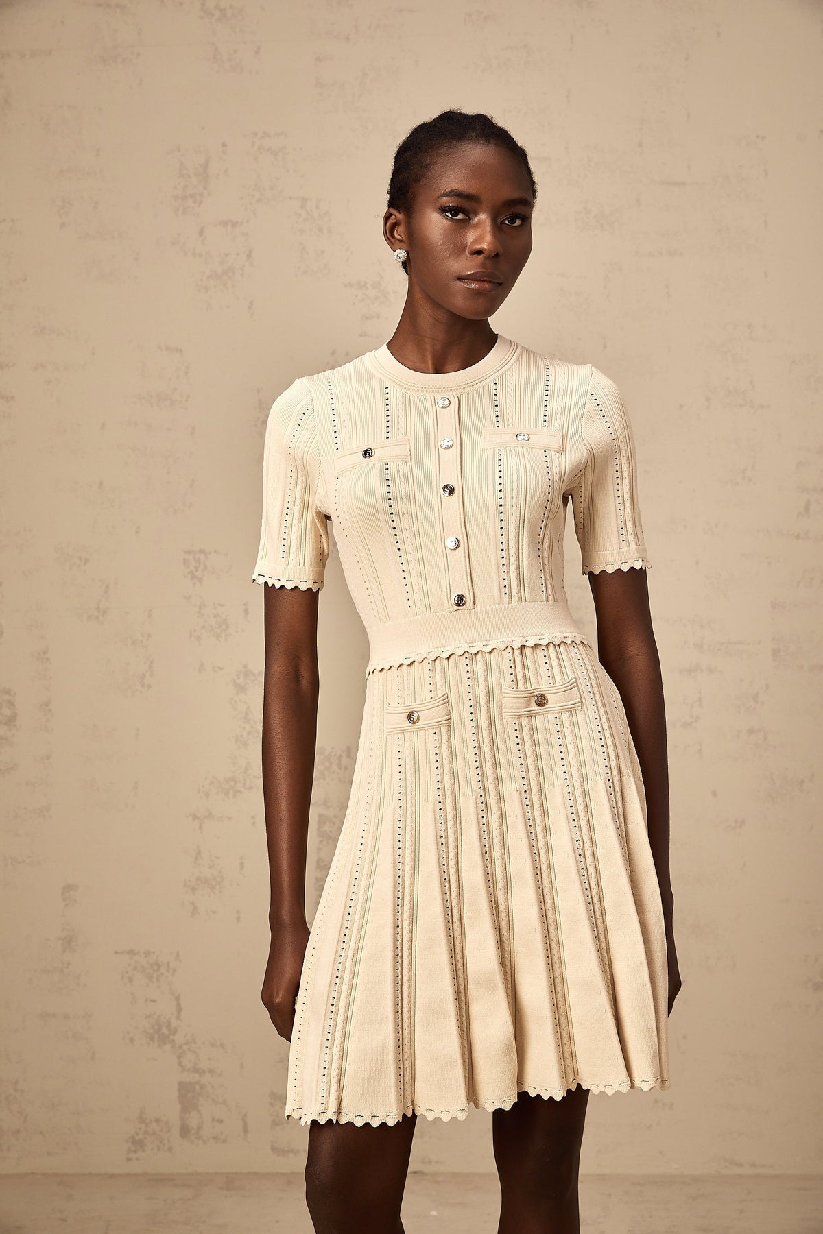 Amélie neutrals pointelle-trim pleated knit mini dress