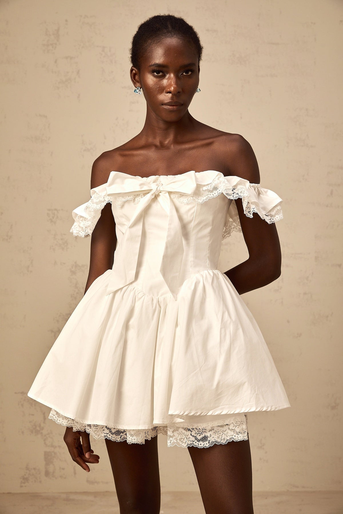 Arsène white oversize-bow ruffled mini dress