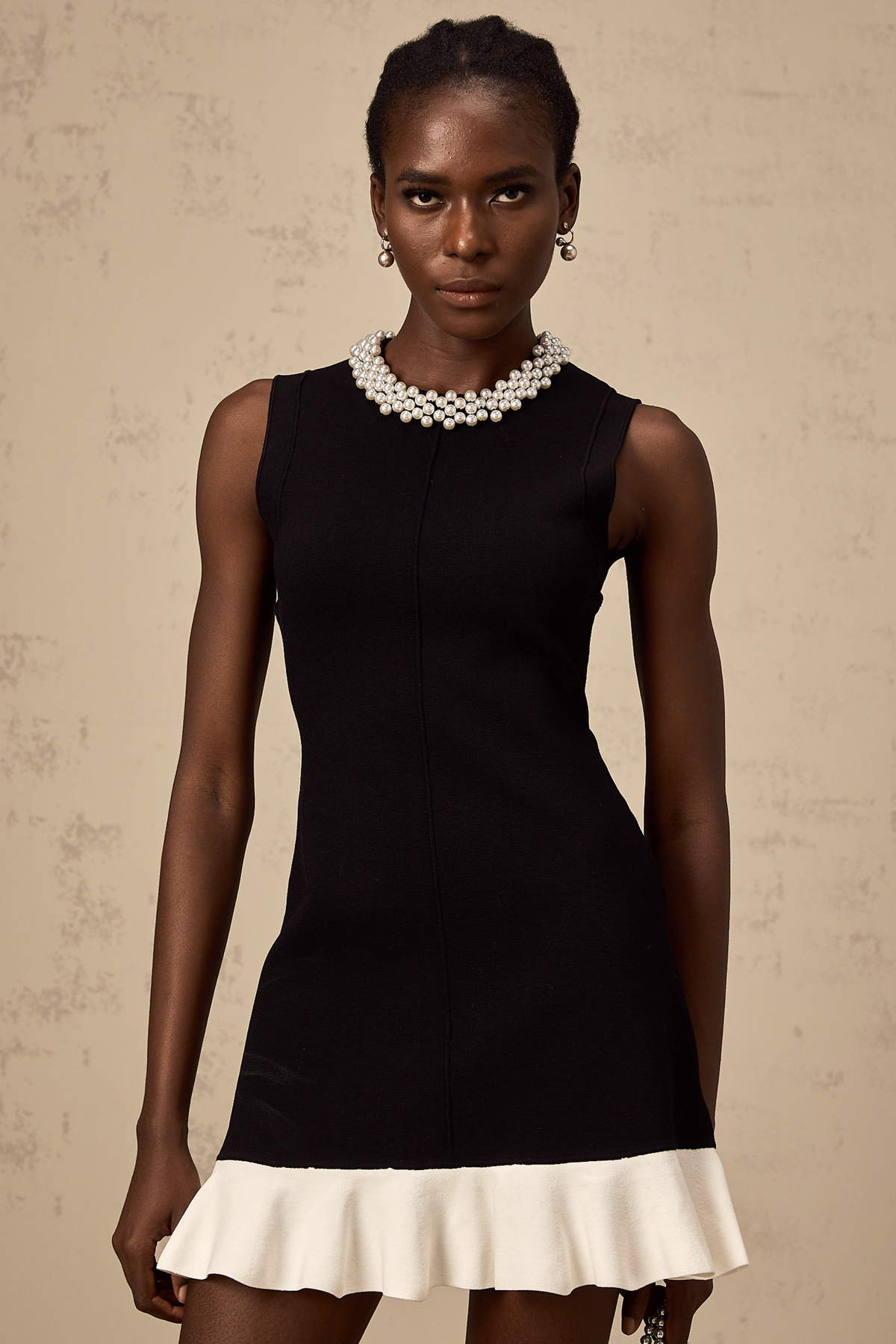 Elodie black faux-pearl ruffled knitted mini dress