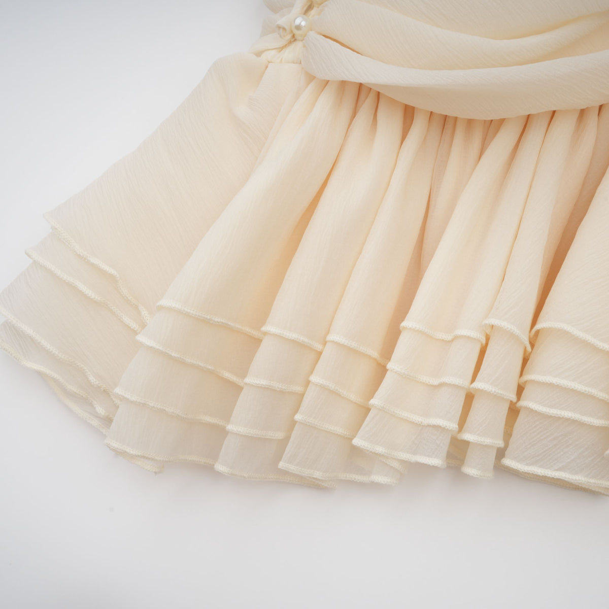 Bérénice white halterneck faux-pearl mini dress